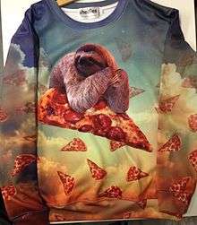 A sweater printed using dye sublimation, featuring an all-over print depicting a sloth resting its elbows on a slice of pizza in the sky