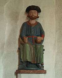 Statue of Saint Olaf wearing a tricorne uniform hat.