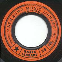 Orange Muzak record label, with large hole