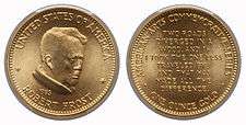 A gold medallion depicting a man and text