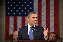 Obama speaks in front of Joe Biden and John Boehner.