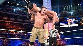 John Cena performing a final AA on the Rock to win the match