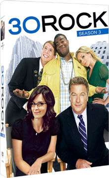 Two men in suits, a black man in a yellow jacket, a blond woman in green, and a brunette woman in black with glasses on a box labeled "30 ROCK SEASON 3"