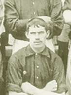 A black-and-white photograph of Abraham Foxall, posing for a team photo.