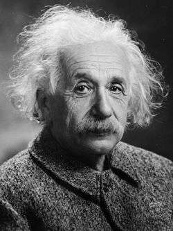 A photograph of Albert Einstein, with flowing, white hair