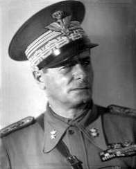 black and white picture of a male in Italian uniform with peaked cap