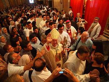 Archbishop Ezzati Andrello greets the faithful.