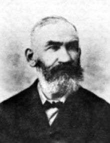 b&w portrait photo of a bearded man