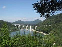Concrete motorway bridge spanning lake