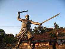 Statue of Baji Prabhu in a mardani khel dual-sword stance