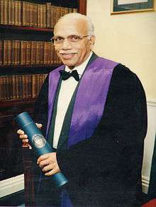 Image of man with black gown.