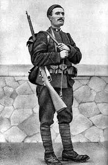 standing photo of Mussolini in 1917 as an Italian soldier