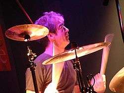 Bill Berry behind a drum kit