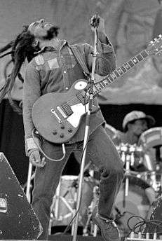 Bob Marley onstage with a guitar