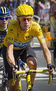 Bradley Wiggins wearing a yellow cycling jersey.