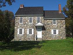 A two-story fieldstone house