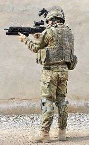 A British Army infantryman showing full combat dress and standard personal kit (back)