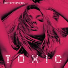 Image of a blonde woman with a layer of pink. She has her arms extended over her head. On the upper left side of the image, the words "Britney Spears" are written in white letters. Underneath, "Toxic" is written in big white letters.