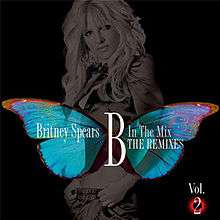 Image of a woman in a grey tone, standing in front of a black background. A giant butterly extends in her bust. The words "Britney Spears B In The Mix The Remixes" are written above in white letters.