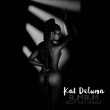 A black and white photo of a naked woman with a long ponytail which covers her buttocks with the words "Kat DeLuna" in a bold white font and the words "BUM BUM FEAT. TREY SONGZ" in a faint white font.