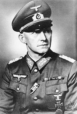 A black-and-white photograph of a military figure with a chest order in the shape of an Iron Cross.