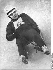 Ortrun Enderlein participating in luge, in the middle of her run