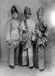 Three men in ceremonial dress