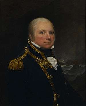 Half-length portrait of a man facing to the right, in a gold buttoned and braided navy blue coat