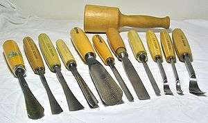Various hand tools for carving wood