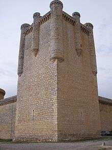 A stone tower at the corner of the defensive walls.