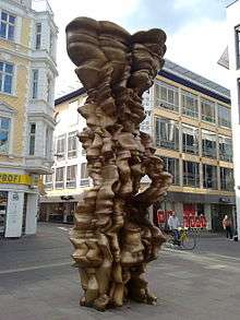 a tall windswept-looking abstract sculpture