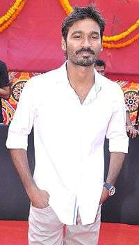 A picture of Dhanush as he looks at the camera