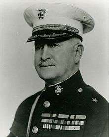 A black and white image of Douglas McDougal, a white male in his Marine Corps dress uniform
