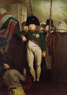 Oil painting of a man in a green uniform, white breeches and black bicorne hat leaning his right arm against a wooden partition draped with a flag.
