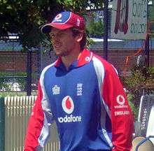  A man in an England long-sleeved cricket shirt and cap
