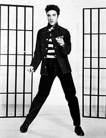 Black-and-white promotional photograph of Elvis Presley from the 1957 film Jailhouse Rock.