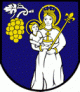 Coat of arms, deep blue background with white figure of Madonna and Child in white dress and yellow halos. The lady carries a staff tipped with a fleur-de-lis. The top left depicts a cluster of yellow grapes on a white stem with a white grape leaf.