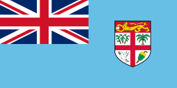 Cyan blue flag with Union Flag as top-left quarter and crest on right side.