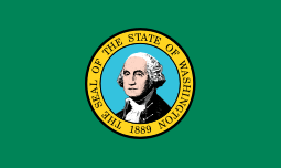 A green flag with a circular seal consisting of concentric circles. The inner circles contains an image of a stately man wearing a powdered wig. The outer circle has the words "The Seal of the State of Washington" and "1889" written clockwise within a yellow banner surrounding the inner circle.