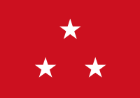 Red flag with three white five-point stars in a centered triange arrangement, peak upward
