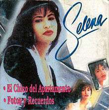 A cardboard box CD cover of Selena looking outwards while posing.