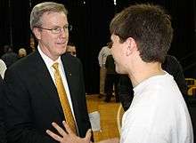 Fran McCaffery talks with an Iowa student after his introduction as the new head basketball coach at The University of Iowa.
