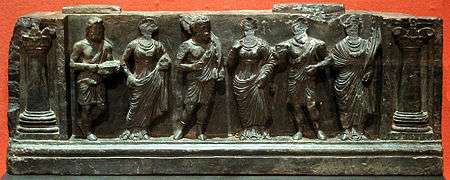 Gandhara frieze with devotees, holding Plantain leaves 1st-2nd century AD.