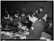 Gene Krupa playing two splash cymbals
