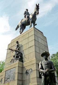 A bronze equestrian statue of a general, positioned atop a granite pedestal