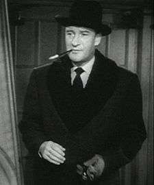 Black-and-white photo of George Sanders from the trailer of the 1950 film All About Eve.