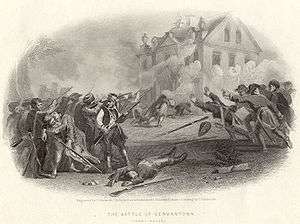 Black and white print of soldiers firing at a two-story house. Clouds of smoke are coming from the windows of the building.