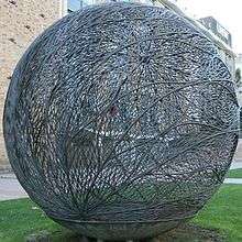 A three metre-diameter globe-shaped bronze sculpture fabricated out of brazed copper alloy wire