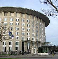Picture of the building of the OPCW, flying an OPCW flag