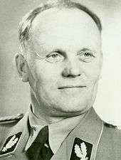 A black-and-white photograph of the head and shoulders of a man in his mid-forties, looking to the right of the viewer. He is wearing a Second World War German military uniform.